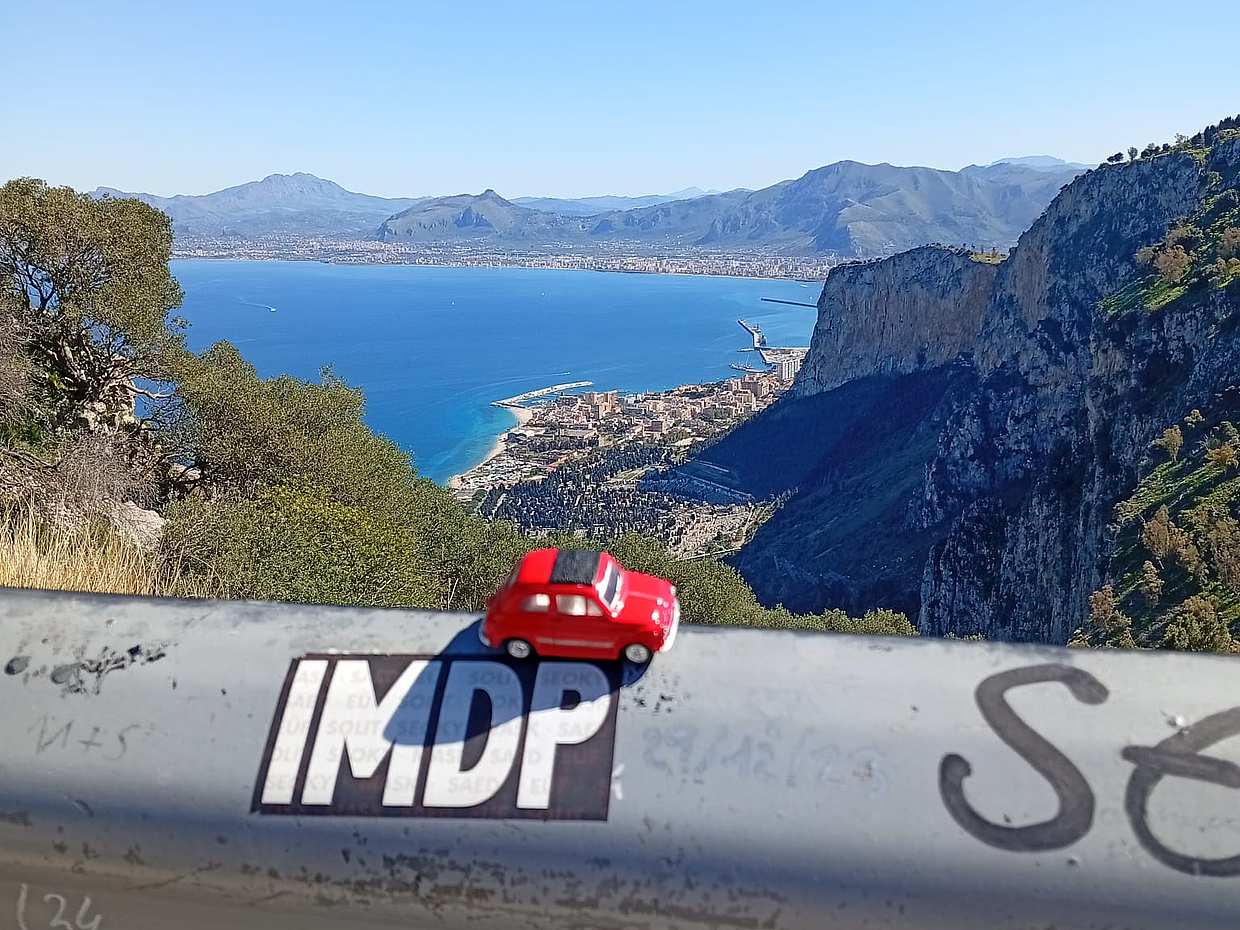 An iconic vintage Fiat 500 driving around Palermo in Italy, photo 2