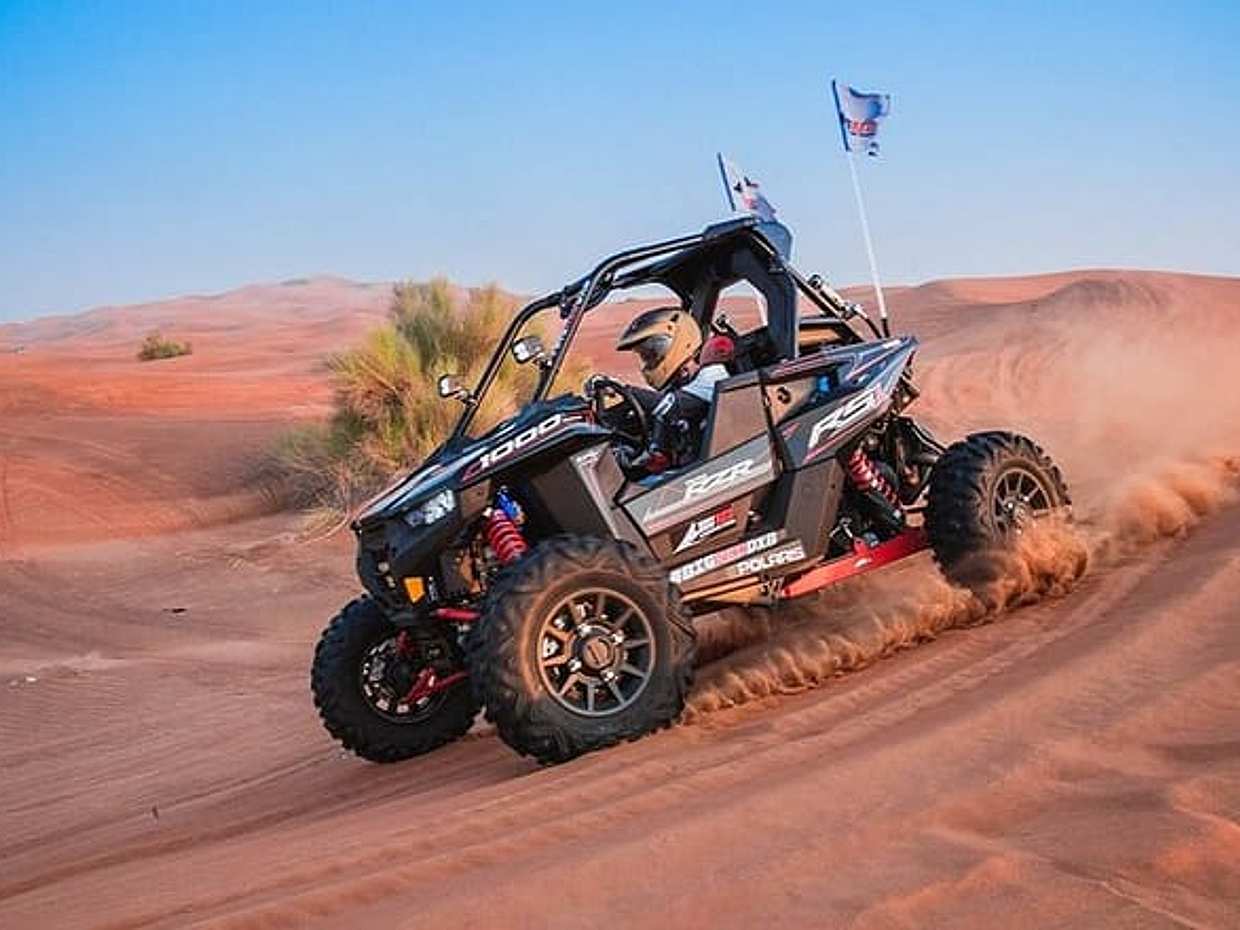 Dubai Desert Safari with Single Seater Buggy, Camel Riding, BBQ.