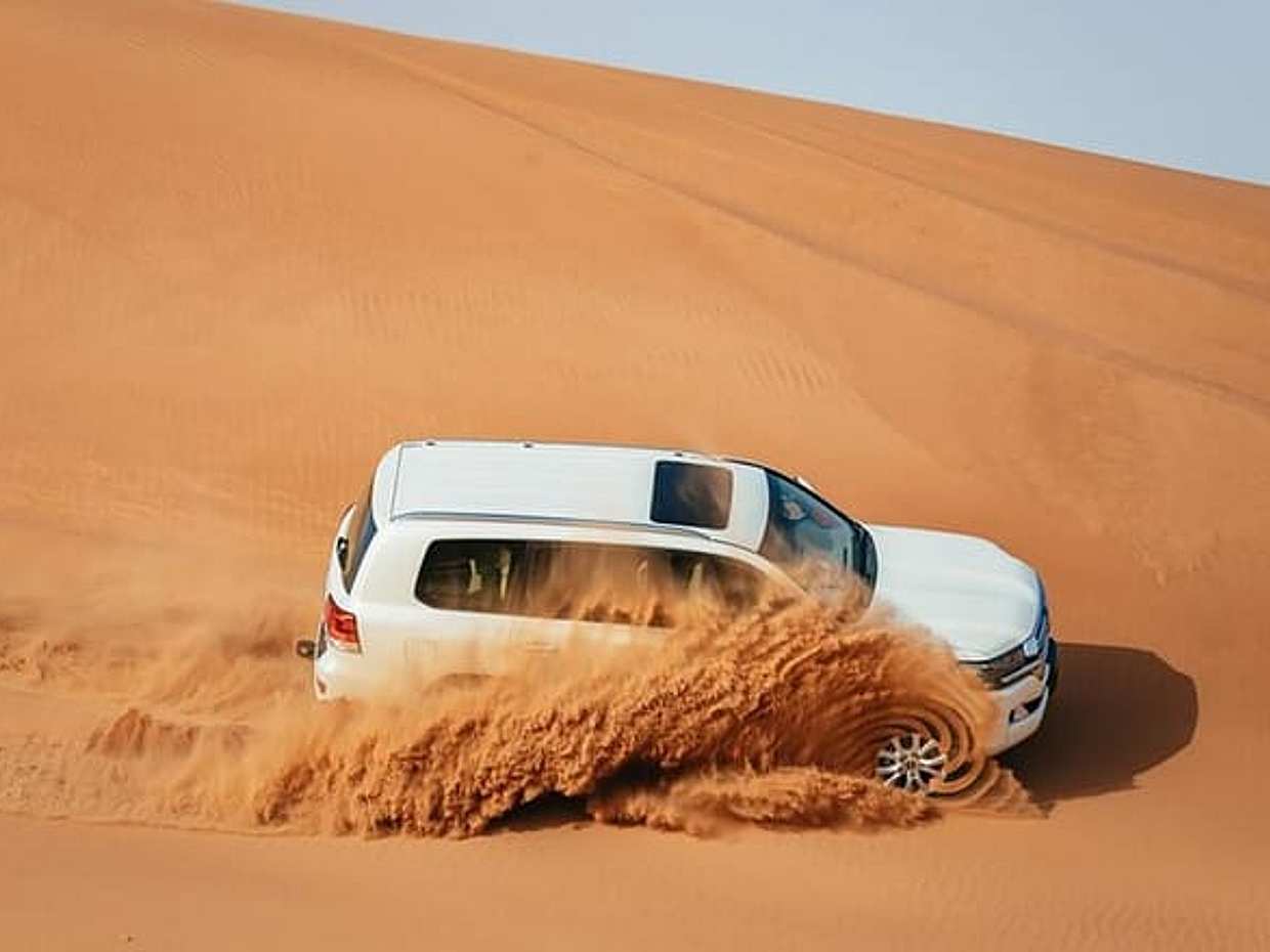 Dubai: Jeep Desert Safari, Camel Ride, and Quad Bike Tour in United Arab Emirates