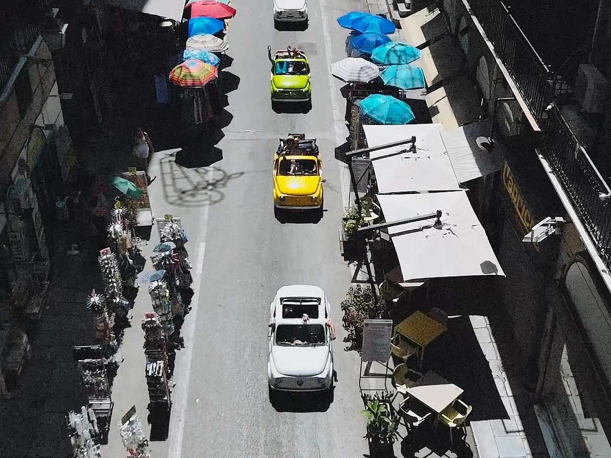 An iconic vintage Fiat 500 driving around Palermo in Italy, photo 5
