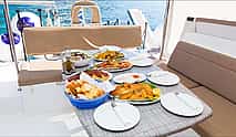 Фото 4 Luxury Sailing Catamaran Daytime Cruise with BBQ & Cocktails