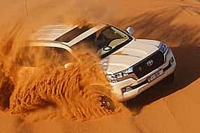 Foto 1 Dubai High Red Dunes Desert Safari  with sand boarding & camel ride Adventure Tour