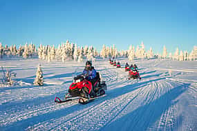 Photo 1 Small Group Snowmobile Driving in Nature