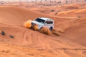 Photo 1 Morning Desert Safari with Sandboarding and Camel Ride