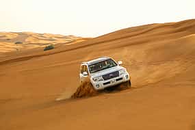 Photo 1 Dubai Evening Desert Safari with BBQ Dinner and Dune Bashing