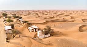 Photo 1 Private Ghost Village Safari Tour with Dune Bashing and Sandboarding