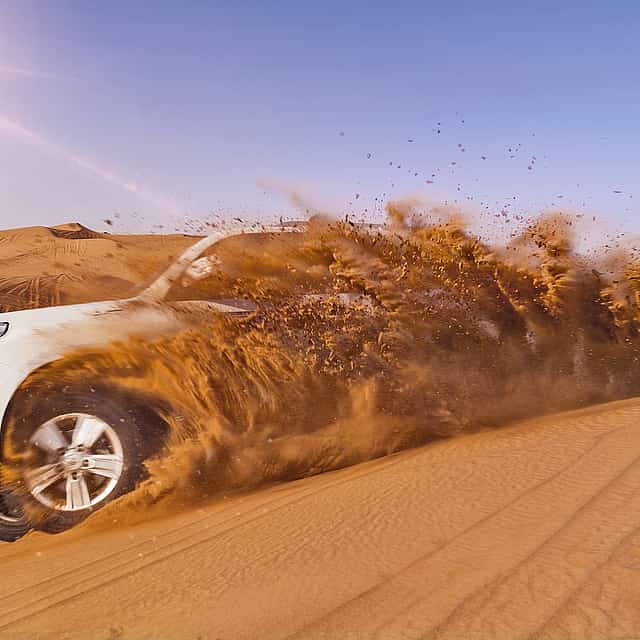The Ghost Village Safari Tour with Dune Bashing and Sandboarding