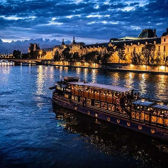 Paris By Night with Seine River Cruise and Roundtrip Luxury Transportation