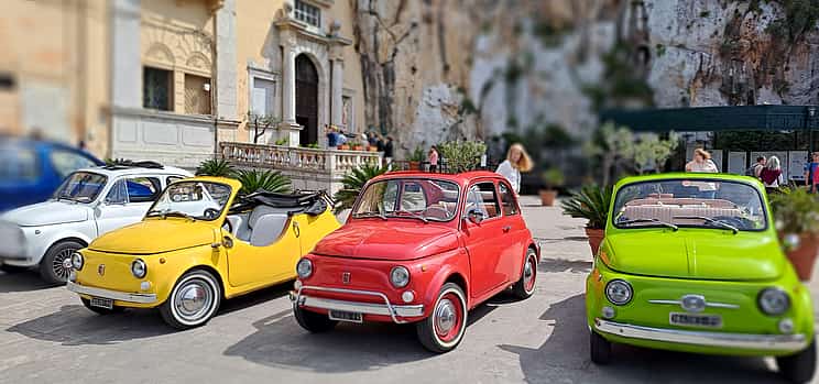 Photo 1 An iconic vintage Fiat 500 driving around Palermo